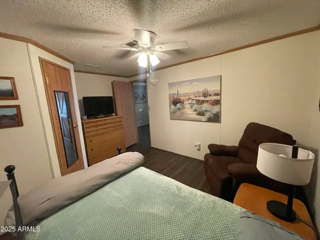 a bedroom with a bed and furniture