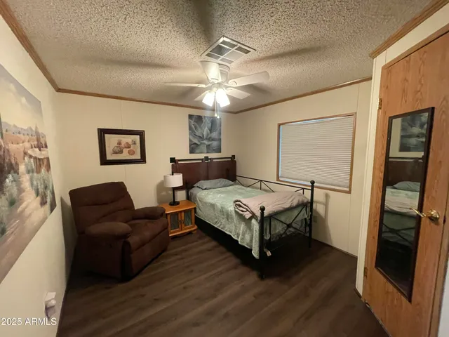 a bedroom with a bed and a couch