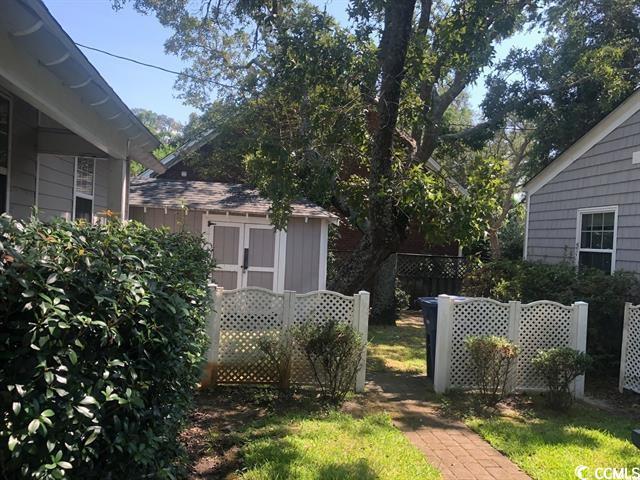 414 36th Avenue North Myrtle Beach, SC 29577 - Photo 18 of 22 View of yard with a storage shed