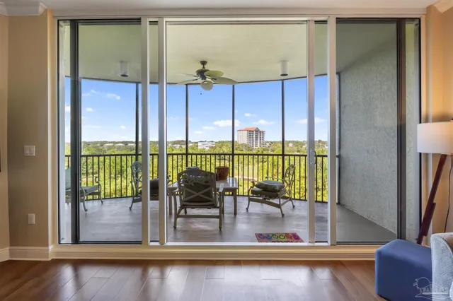 a view of a living room and a balcony