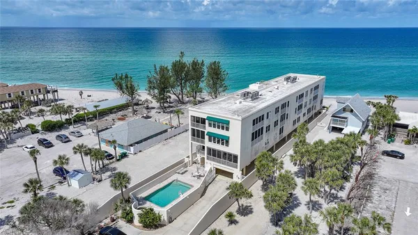 an aerial view of a house with outdoor space