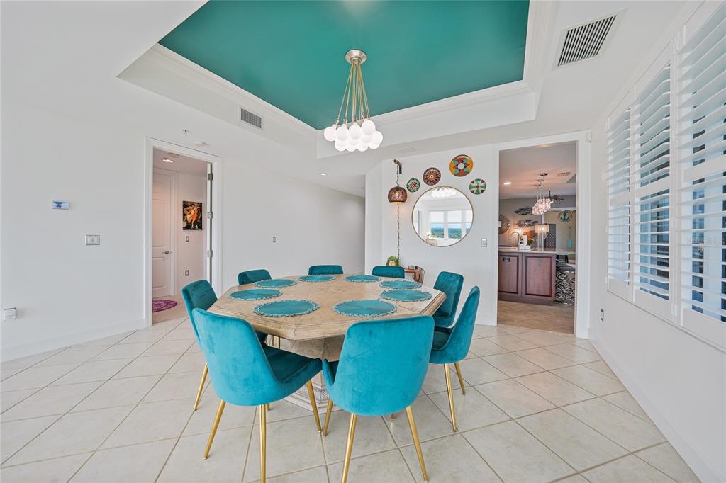 2590 North Beach Road, Unit 5 Englewood, FL 34223 - Photo 15 of 45 a view of a dining room with furniture and chandelier
