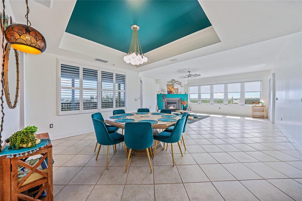 2590 North Beach Road, Unit 5 Englewood, FL 34223 - Photo 16 of 45 a view of a dining room with furniture and chandelier
