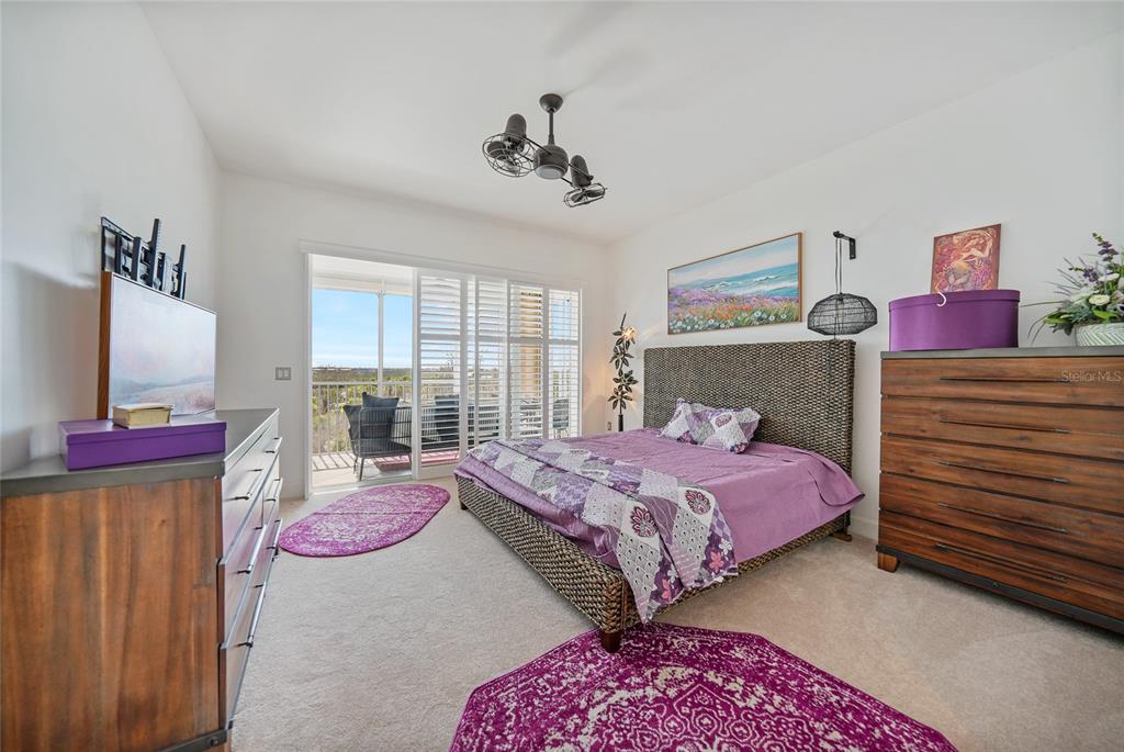 2590 North Beach Road, Unit 5 Englewood, FL 34223 - Photo 19 of 45 a bedroom with a bed and a dresser