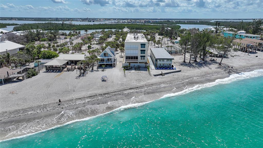 2590 North Beach Road, Unit 5 Englewood, FL 34223 - Photo 25 of 45 an aerial view of a house with garden space and street view