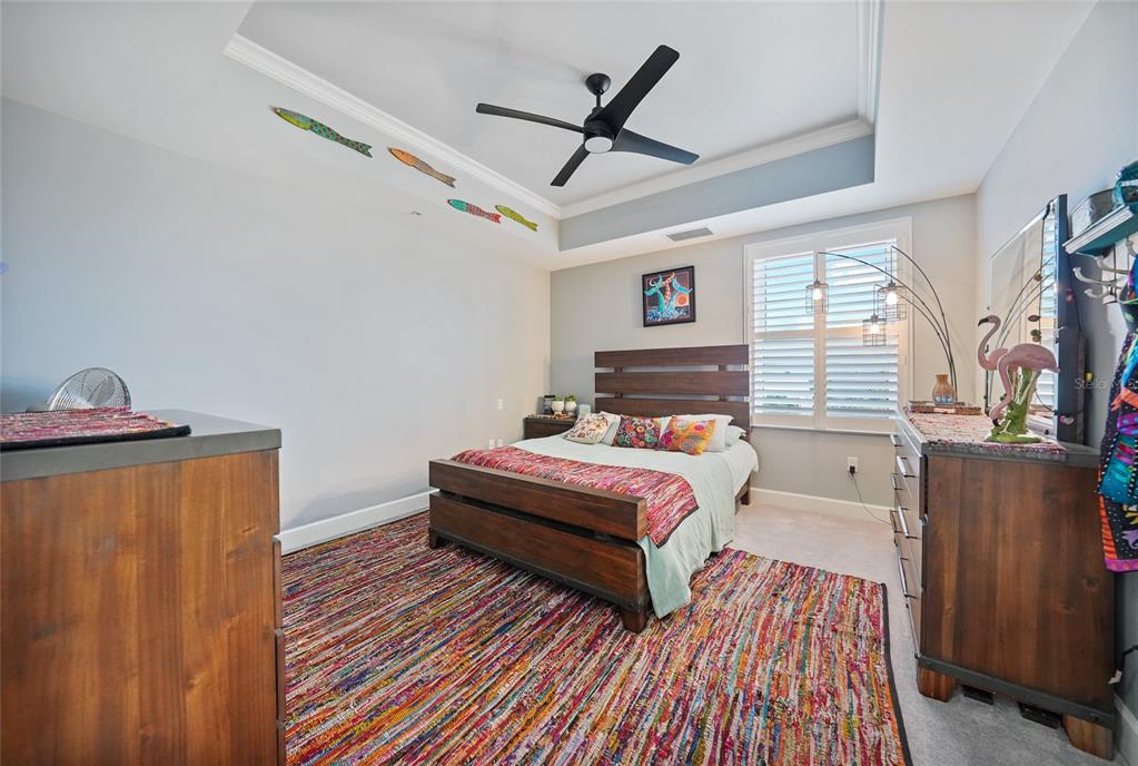 2590 North Beach Road, Unit 5 Englewood, FL 34223 - Photo 29 of 45 a bedroom with a bed and wooden floor