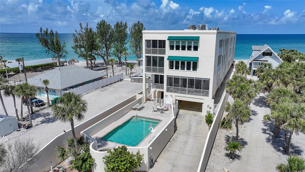 2590 North Beach Road, Unit 5 Englewood, FL 34223 - Photo 33 of 45 aerial view of a house with balcony