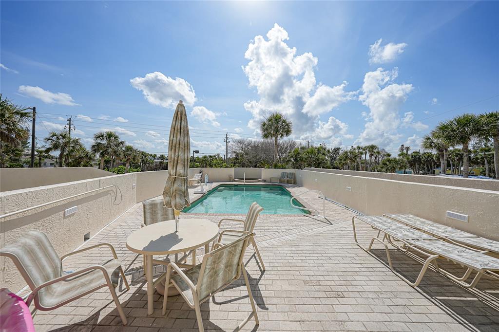 2590 North Beach Road, Unit 5 Englewood, FL 34223 - Photo 36 of 45 a view of a terrace with furniture