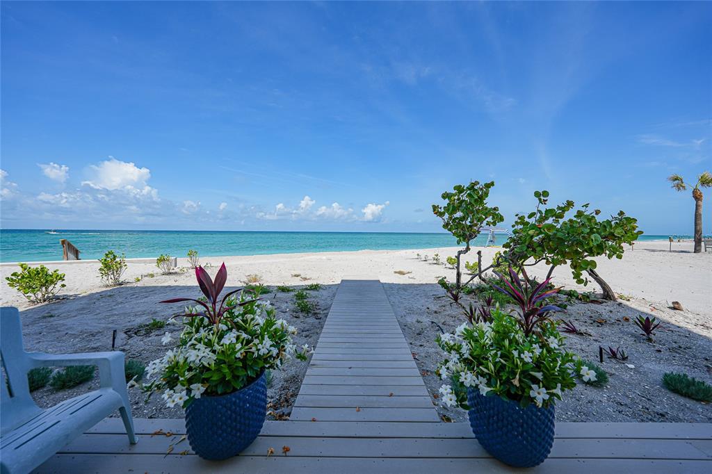 2590 North Beach Road, Unit 5 Englewood, FL 34223 - Photo 38 of 45 a view of a terrace with a garden