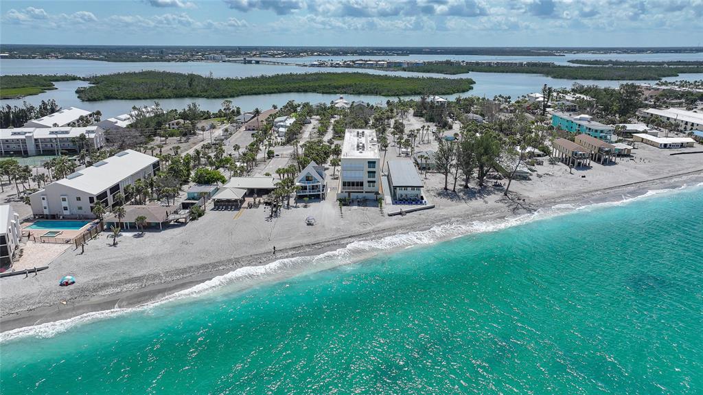 2590 North Beach Road, Unit 5 Englewood, FL 34223 - Photo 4 of 45 a view of a water pond with outdoor seating