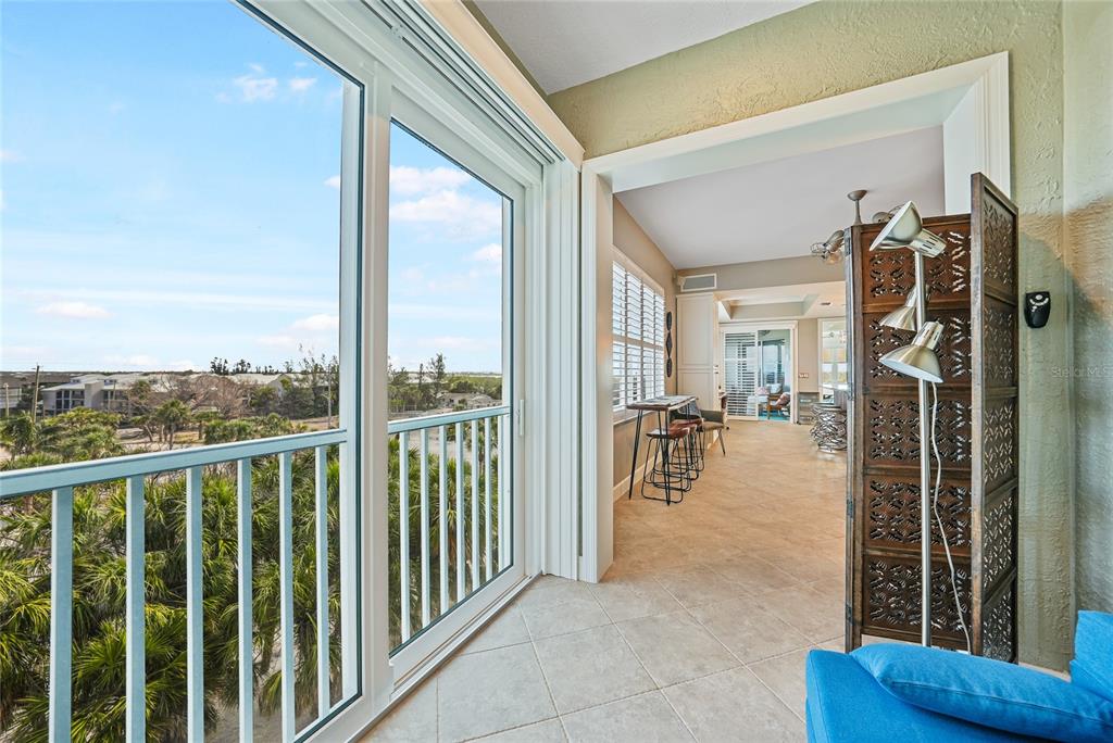 2590 North Beach Road, Unit 5 Englewood, FL 34223 - Photo 44 of 45 a view of a living room and a floor to ceiling window