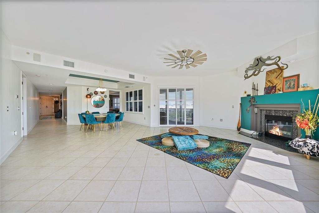 2590 North Beach Road, Unit 5 Englewood, FL 34223 - Photo 5 of 45 a living room with furniture and a fireplace