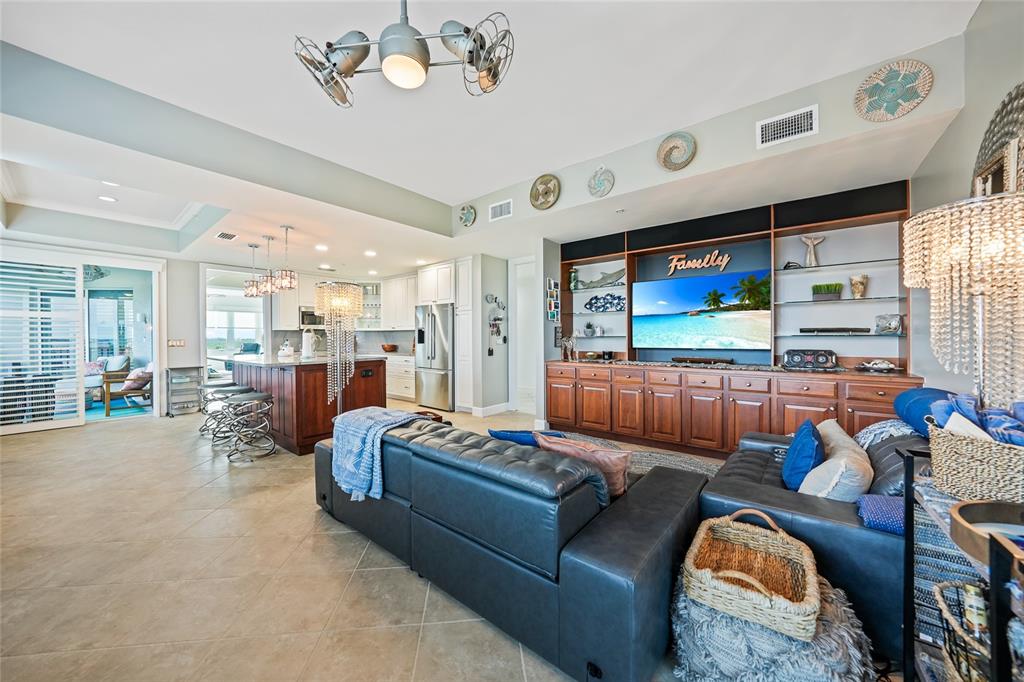 2590 North Beach Road, Unit 5 Englewood, FL 34223 - Photo 10 of 45 a living room with furniture kitchen view and a large window