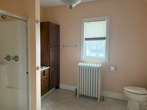 a view of a bathroom with a toilet and a shower
