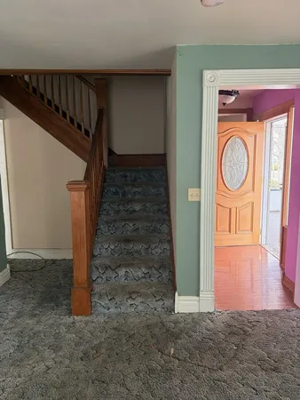 a view of entryway with wooden floor