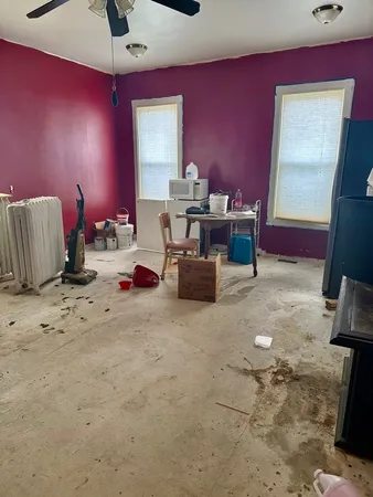 a room with furniture and a flat screen tv