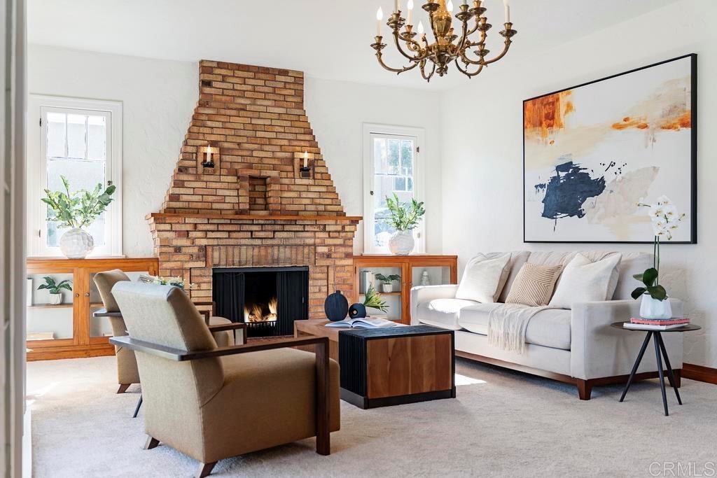 304 La Veta Avenue Encinitas, CA 92024 - Photo 2 of 14 a living room with furniture a fireplace and a large window