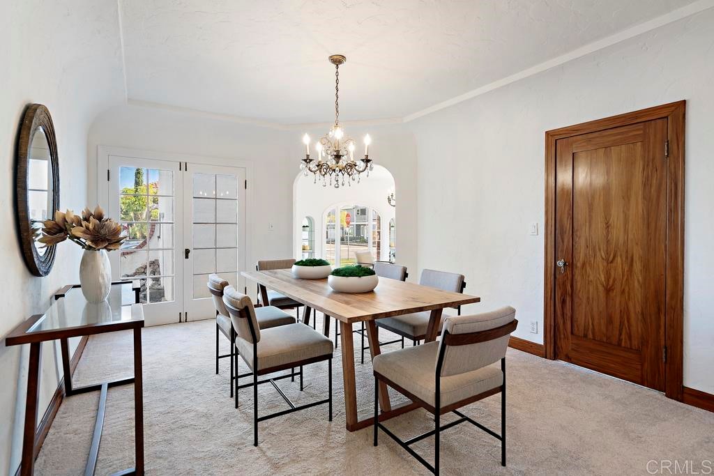 304 La Veta Avenue Encinitas, CA 92024 - Photo 6 of 14 a view of a dining room with furniture and chandelier