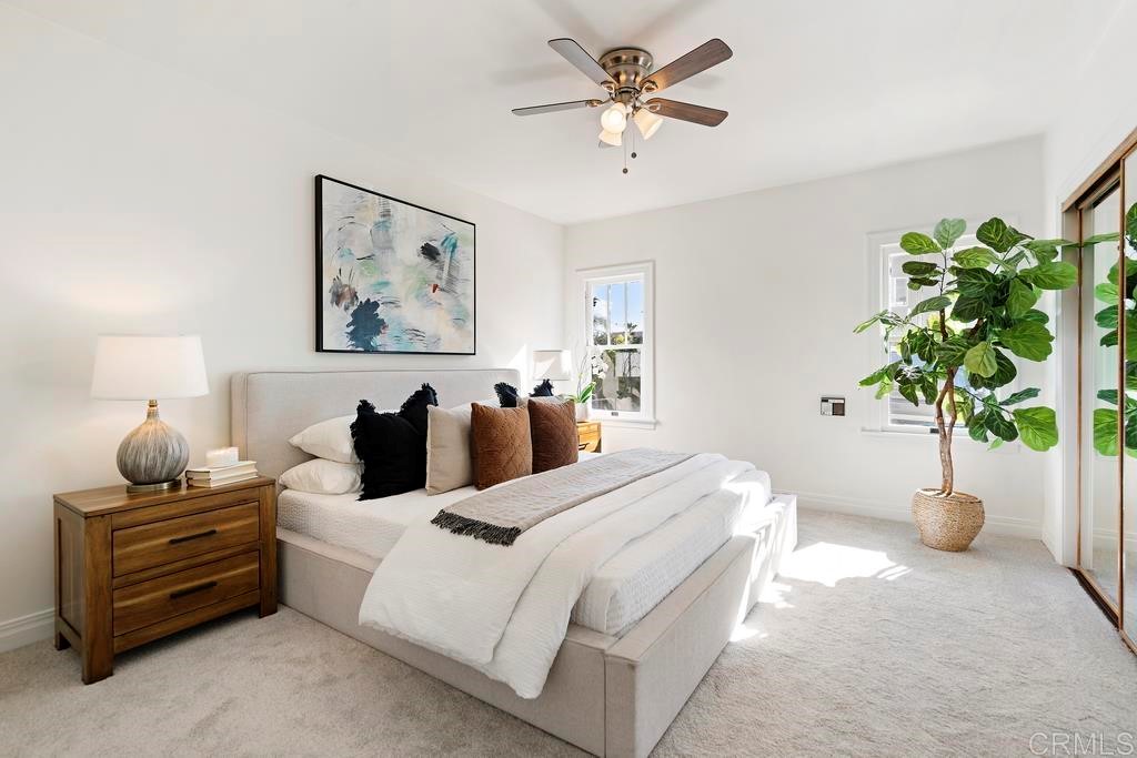 304 La Veta Avenue Encinitas, CA 92024 - Photo 7 of 14 a bedroom with a bed and a potted plant