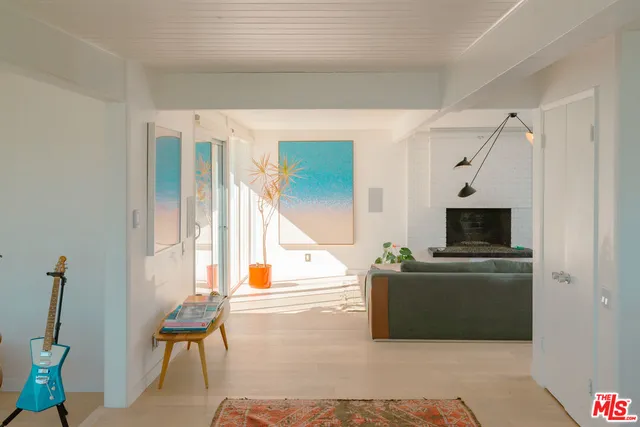 a bed room with furniture and a table