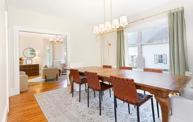 a dinning table and chairs in a room