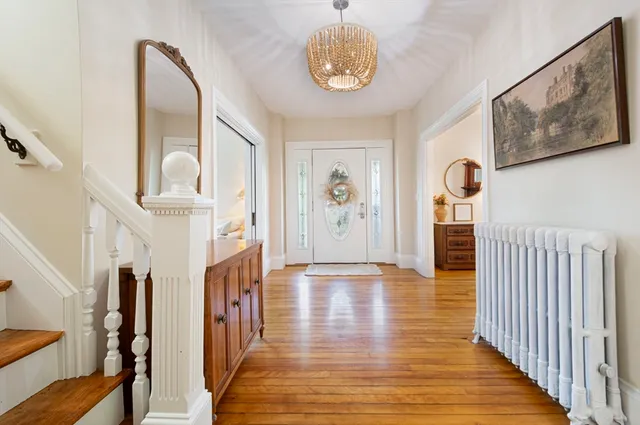 a view of an entryway with wooden floor