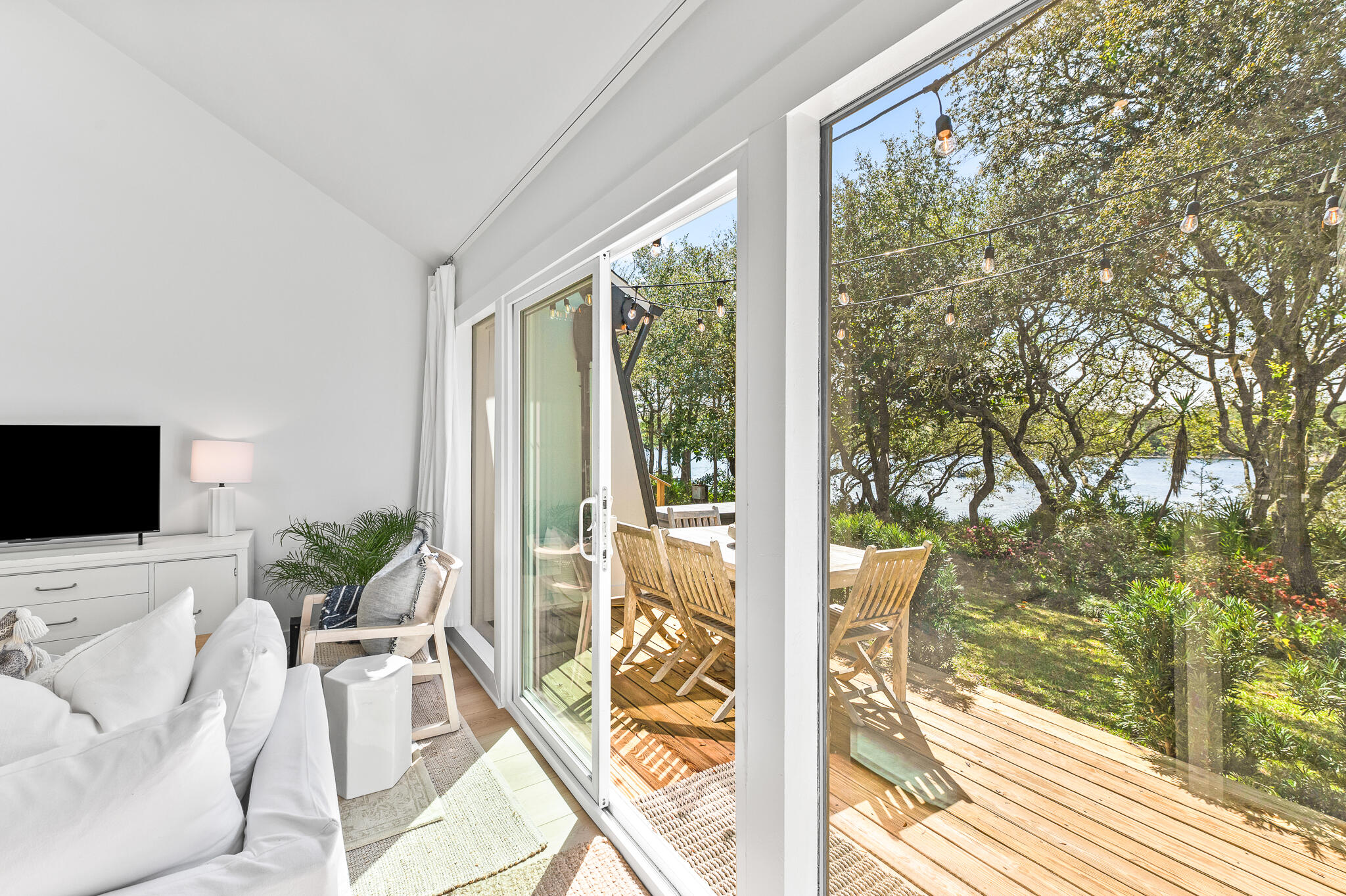70 North Camp Creek Rd Inlet Beach, Unit 3 Inlet Beach, FL 32461 - Photo 28 of 66 a living room with patio furniture and floor to ceiling windows