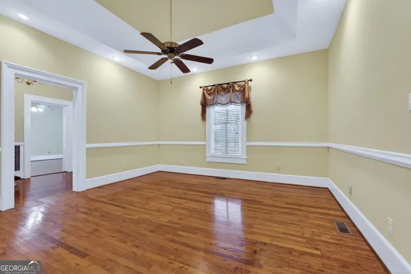 a view of an empty room with windows