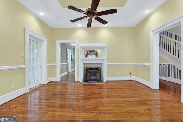 a large kitchen with stainless steel appliances granite countertop a stove refrigerator and a sink