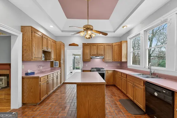 a bathroom with a double vanity sink mirror and shower