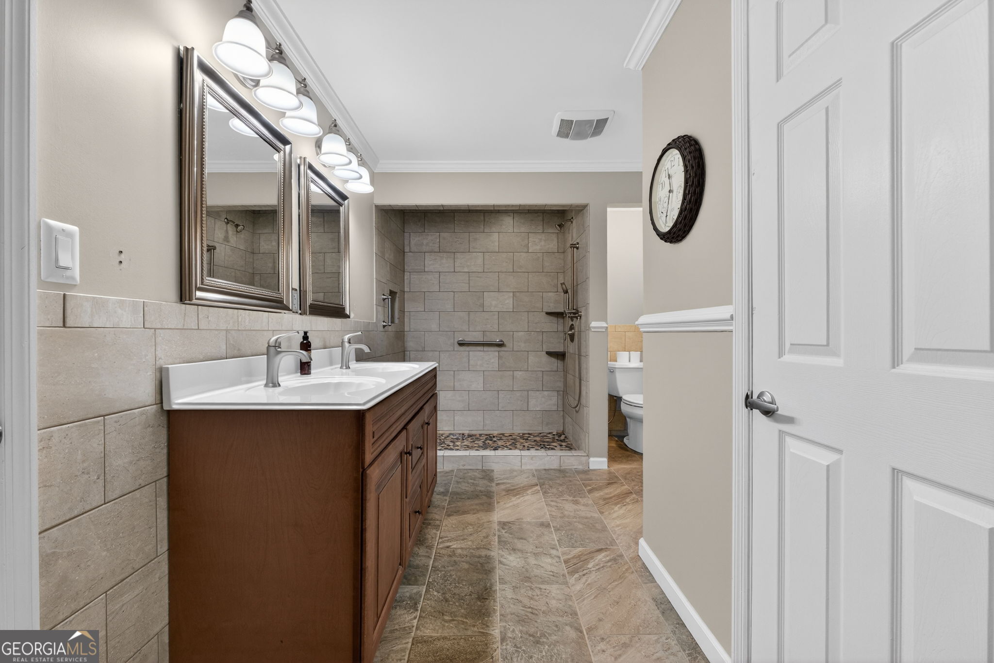 402 Tom Bell Road Milner, GA 30257 - Photo 28 of 75 a bathroom with a sink and mirror