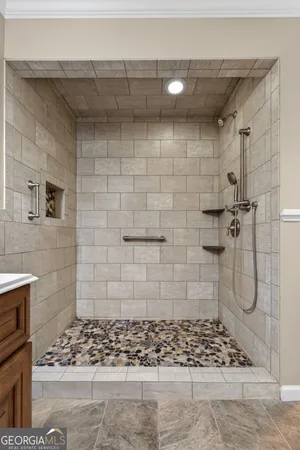 a bathroom with a bathtub and a shower