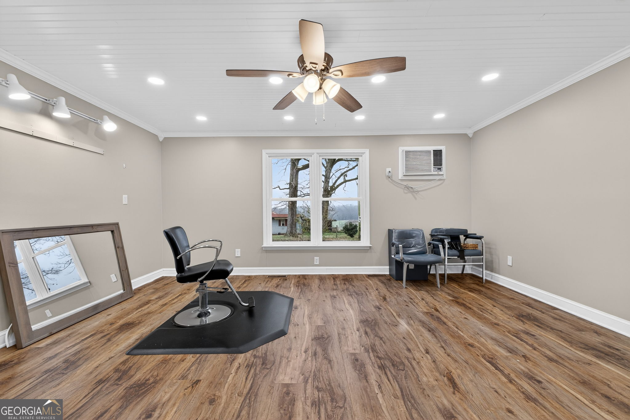 402 Tom Bell Road Milner, GA 30257 - Photo 32 of 75 a living room with furniture and a large window