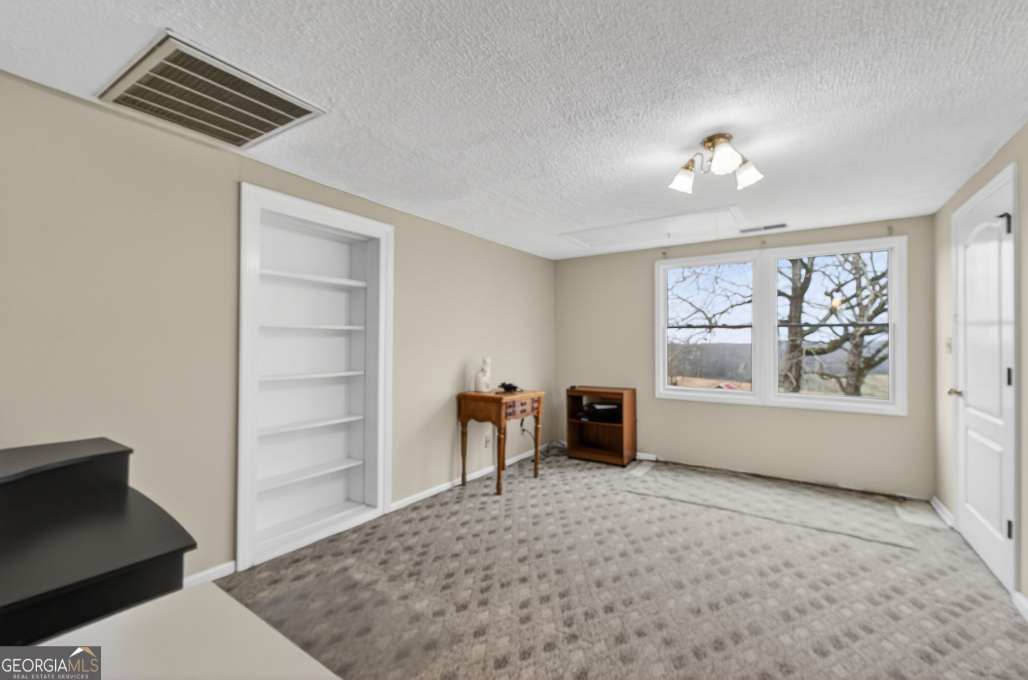 402 Tom Bell Road Milner, GA 30257 - Photo 37 of 75 wooden floor in an empty room with a window