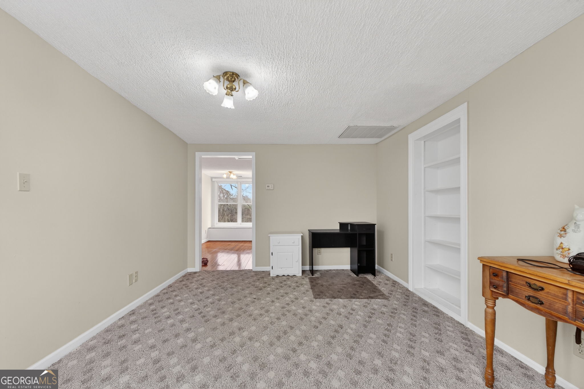 402 Tom Bell Road Milner, GA 30257 - Photo 46 of 75 a bedroom with a bed and a window