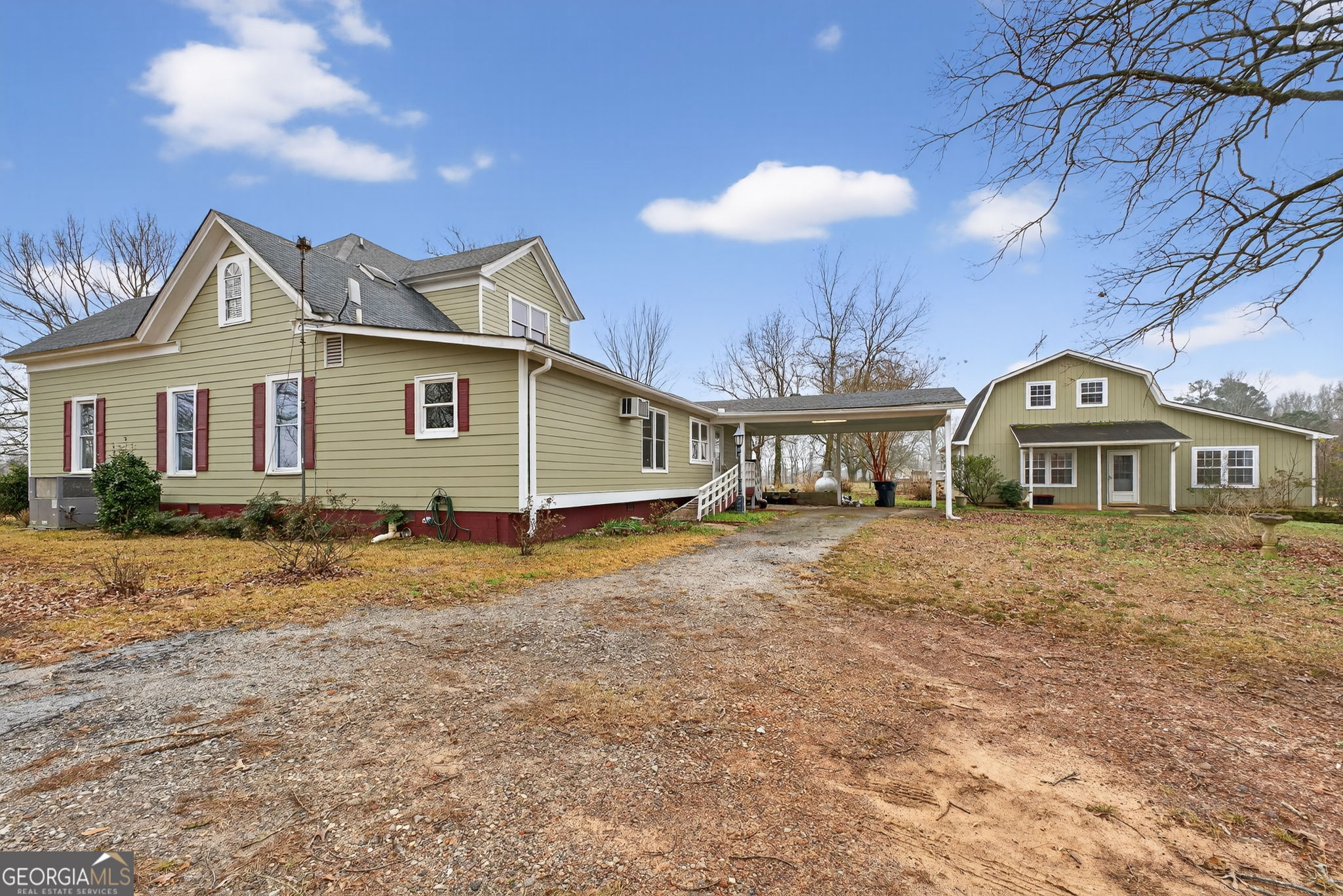 402 Tom Bell Road Milner, GA 30257 - Photo 51 of 75 a view of a house with a yard and balcony