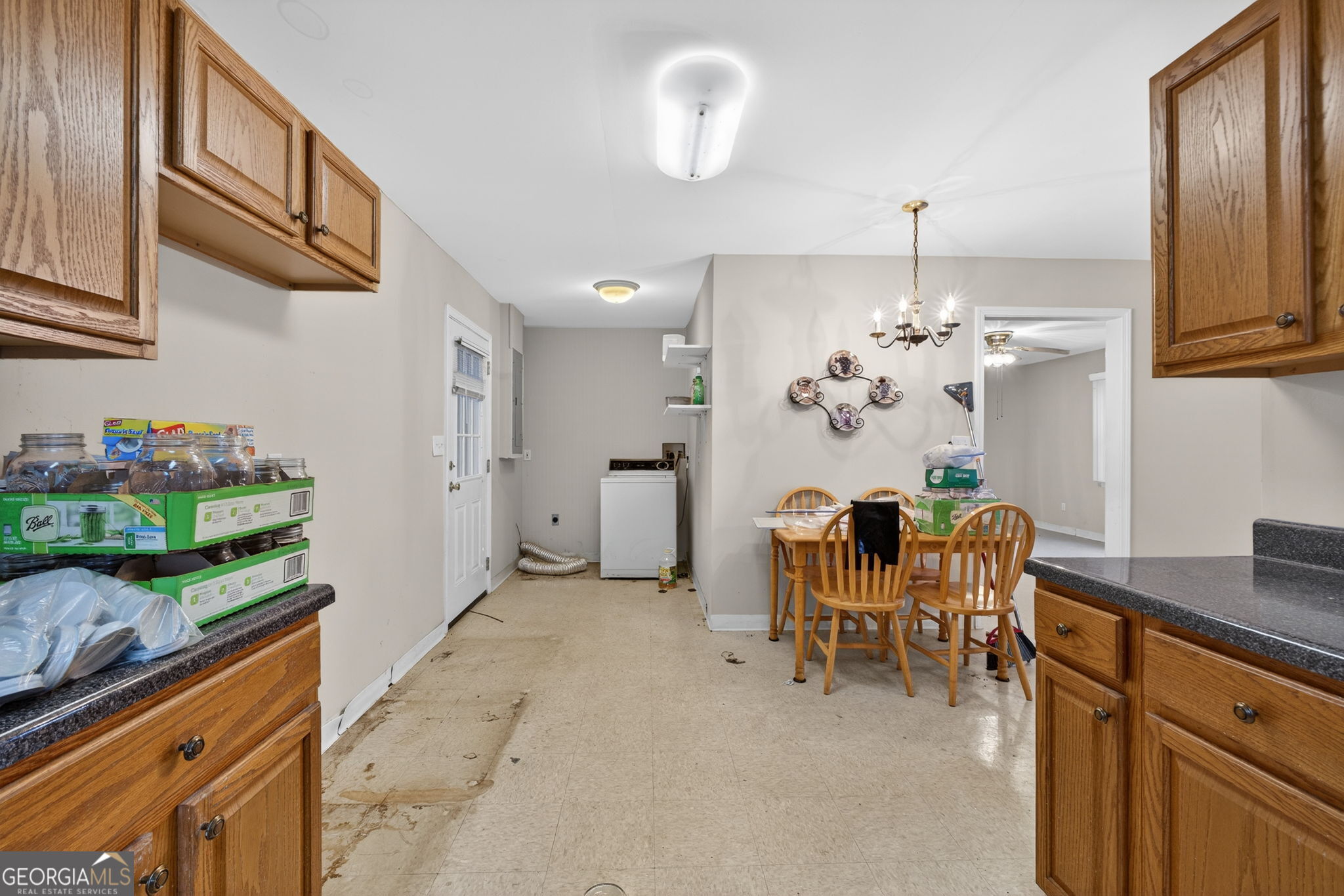 402 Tom Bell Road Milner, GA 30257 - Photo 56 of 75 a view of a dining room with furniture and chandelier
