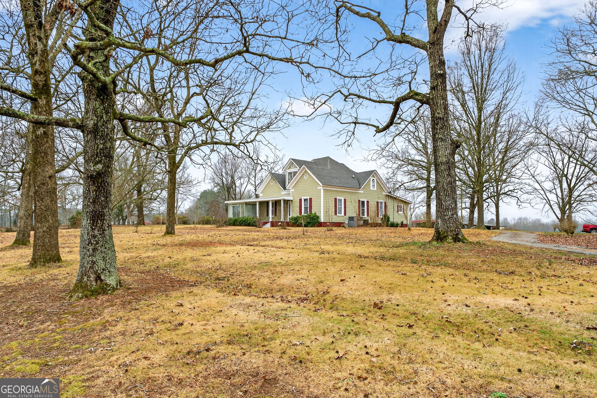 402 Tom Bell Road Milner, GA 30257 - Photo 72 of 75 a front view of a house with a yard