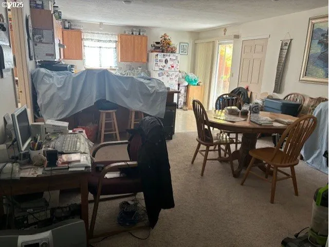 a dining room with furniture and window