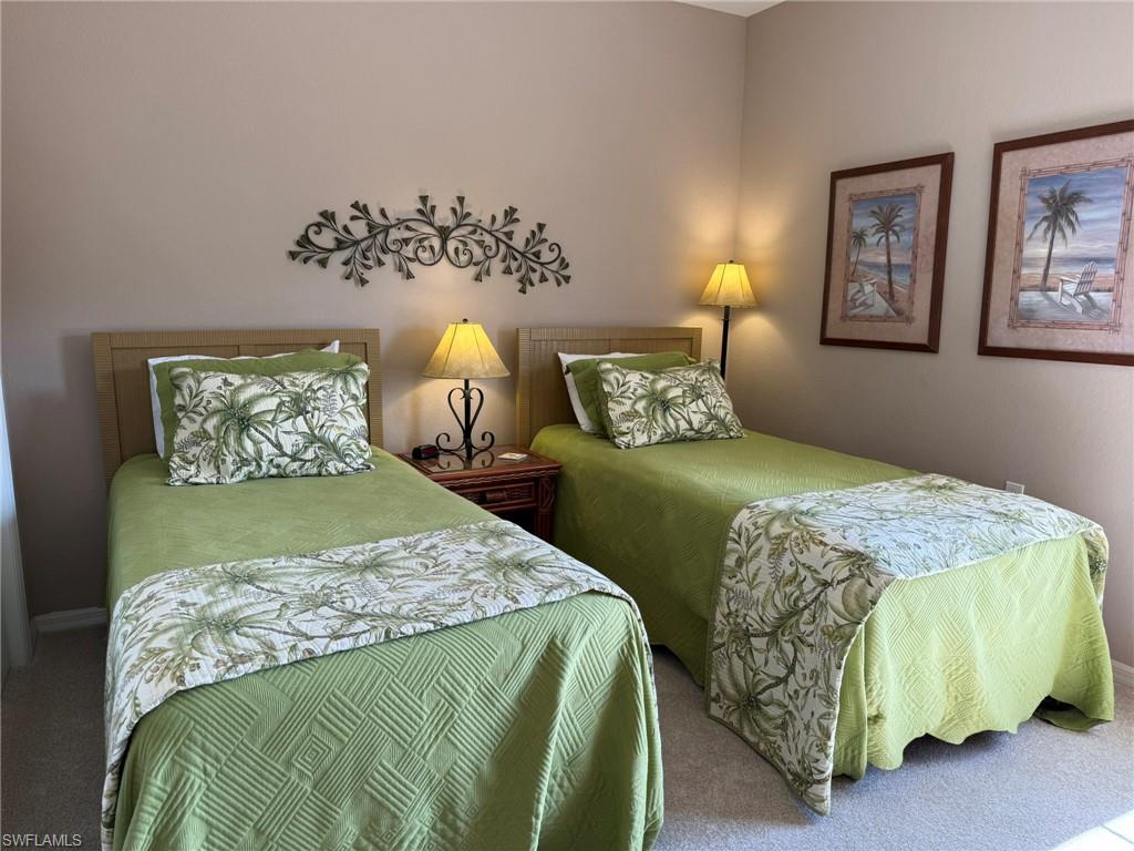 8165 Celeste Drive, Unit 2228 Naples, FL 34113 - Photo 21 of 30 a bedroom with a bed and window