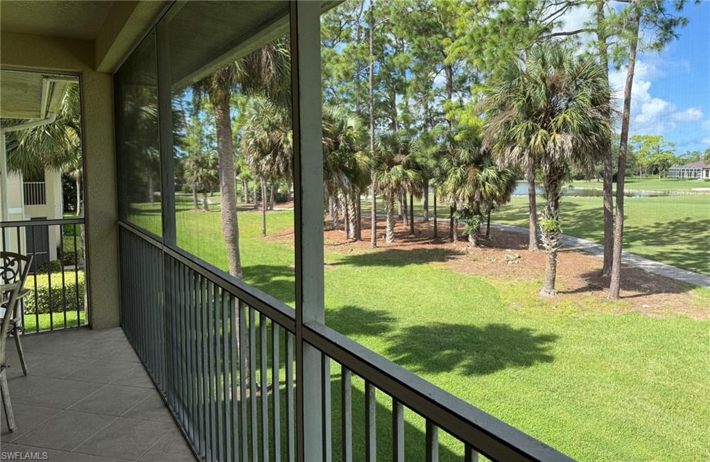 8165 Celeste Drive, Unit 2228 Naples, FL 34113 - Photo 26 of 30 a view of a balcony with trees