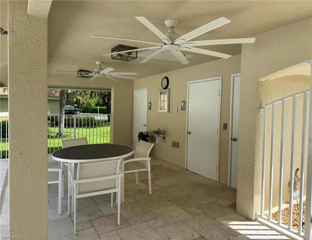 8165 Celeste Drive, Unit 2228 Naples, FL 34113 - Photo 30 of 30 a dining room with furniture and window