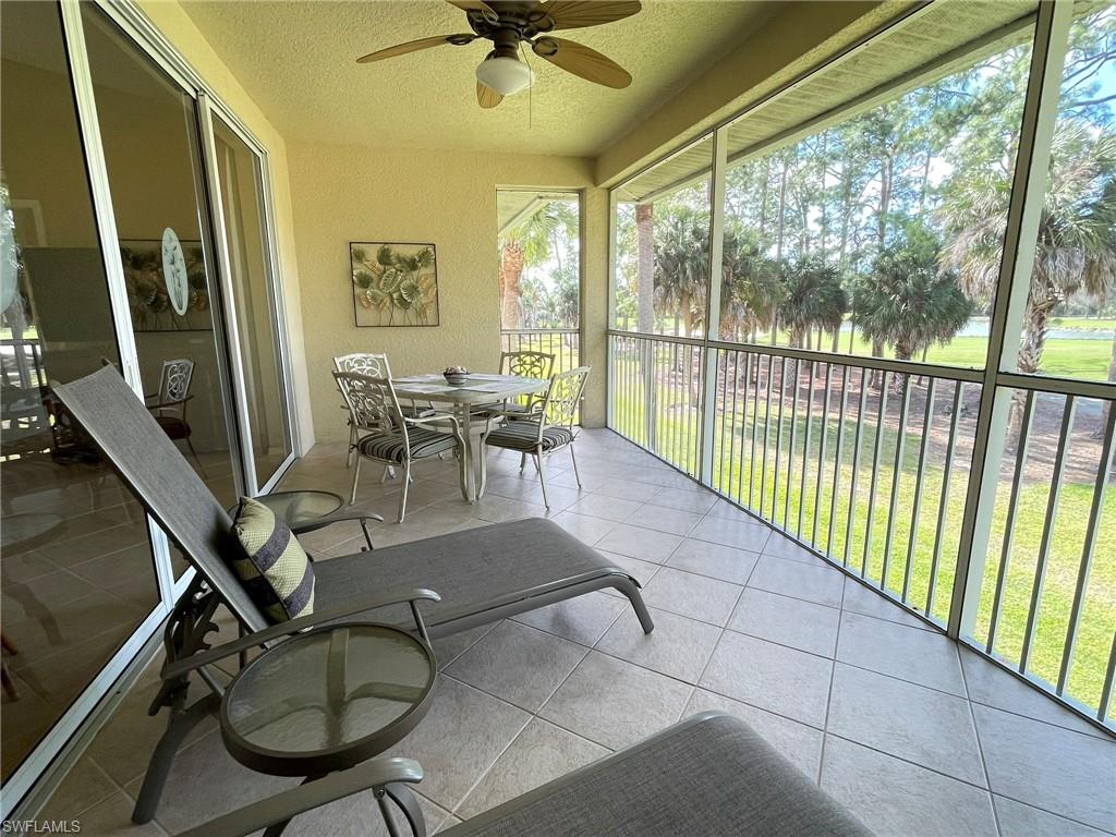 8165 Celeste Drive, Unit 2228 Naples, FL 34113 - Photo 3 of 30 a dining room with furniture water view and a floor to ceiling window