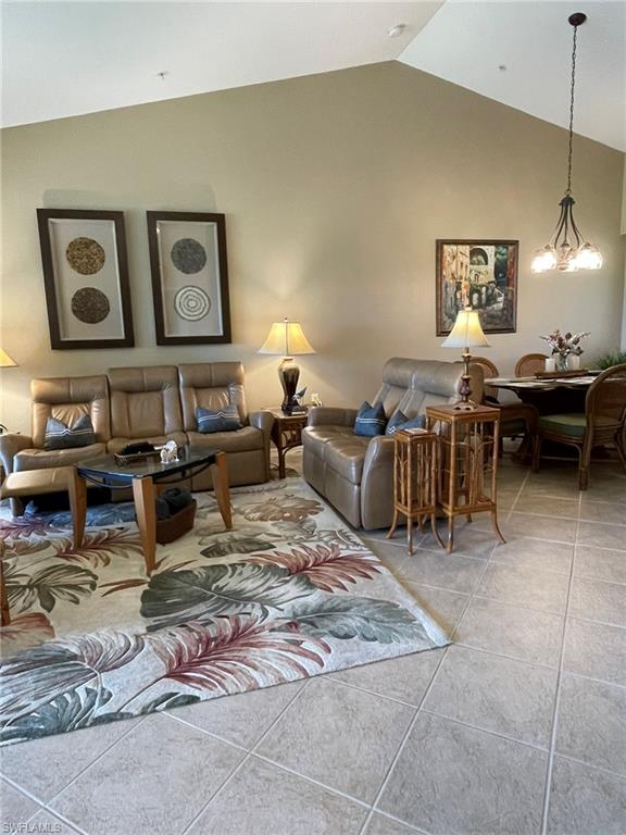 8165 Celeste Drive, Unit 2228 Naples, FL 34113 - Photo 4 of 30 a living room with furniture and a dining table
