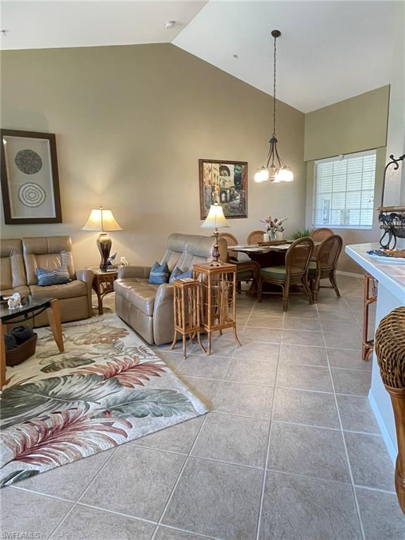 8165 Celeste Drive, Unit 2228 Naples, FL 34113 - Photo 8 of 30 a living room with lots of furniture and a wooden floor