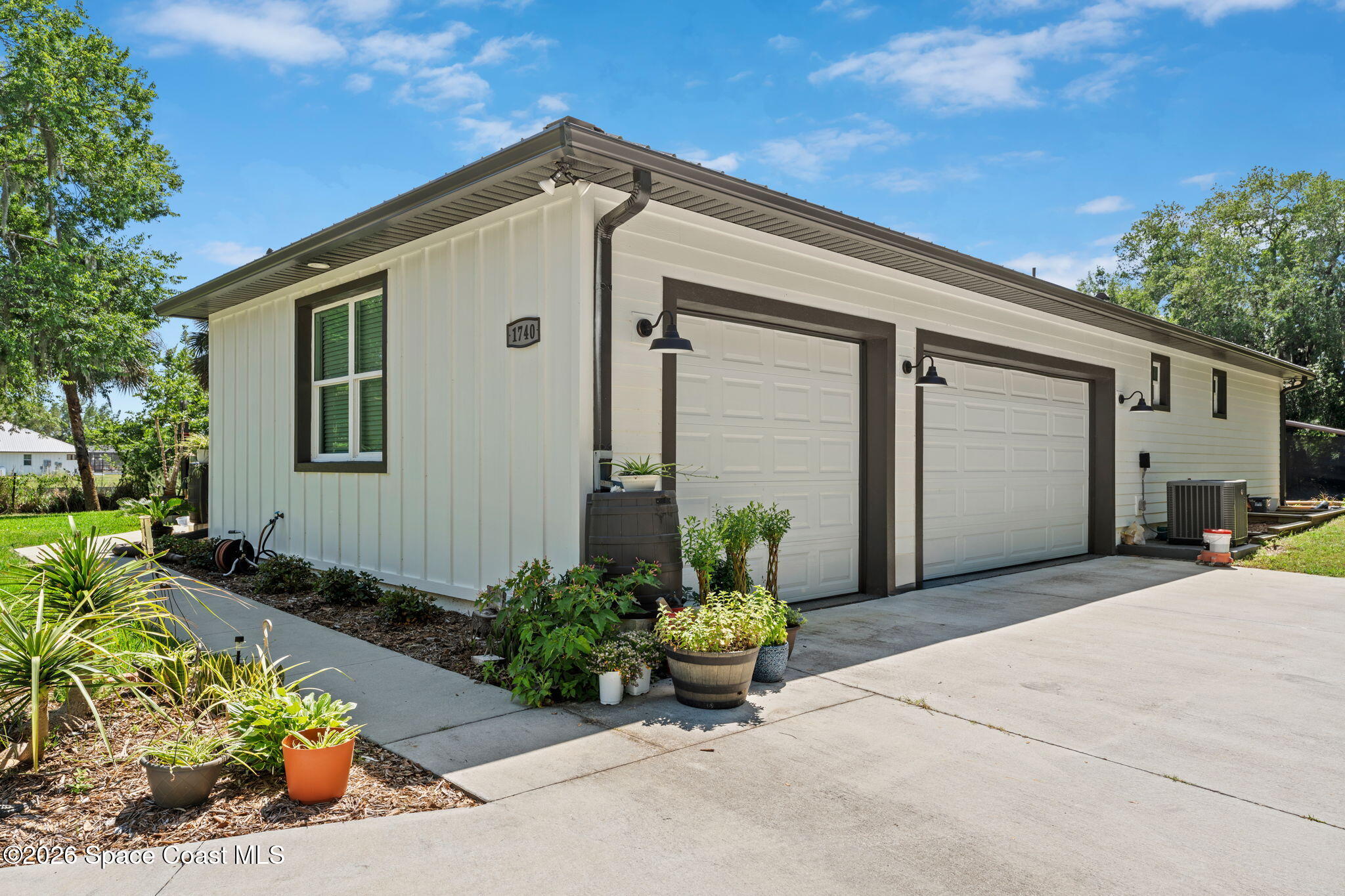 1740 Ford Road Mims, FL 32754 - Photo 37 of 43 a front view of a house with a yard