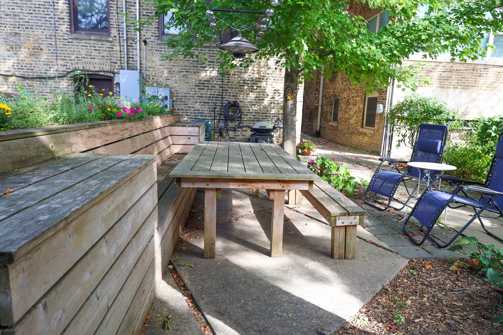 616 Michigan Avenue, Unit G Evanston, IL 60202 - Photo 19 of 20 a view of backyard with outdoor seating and plants
