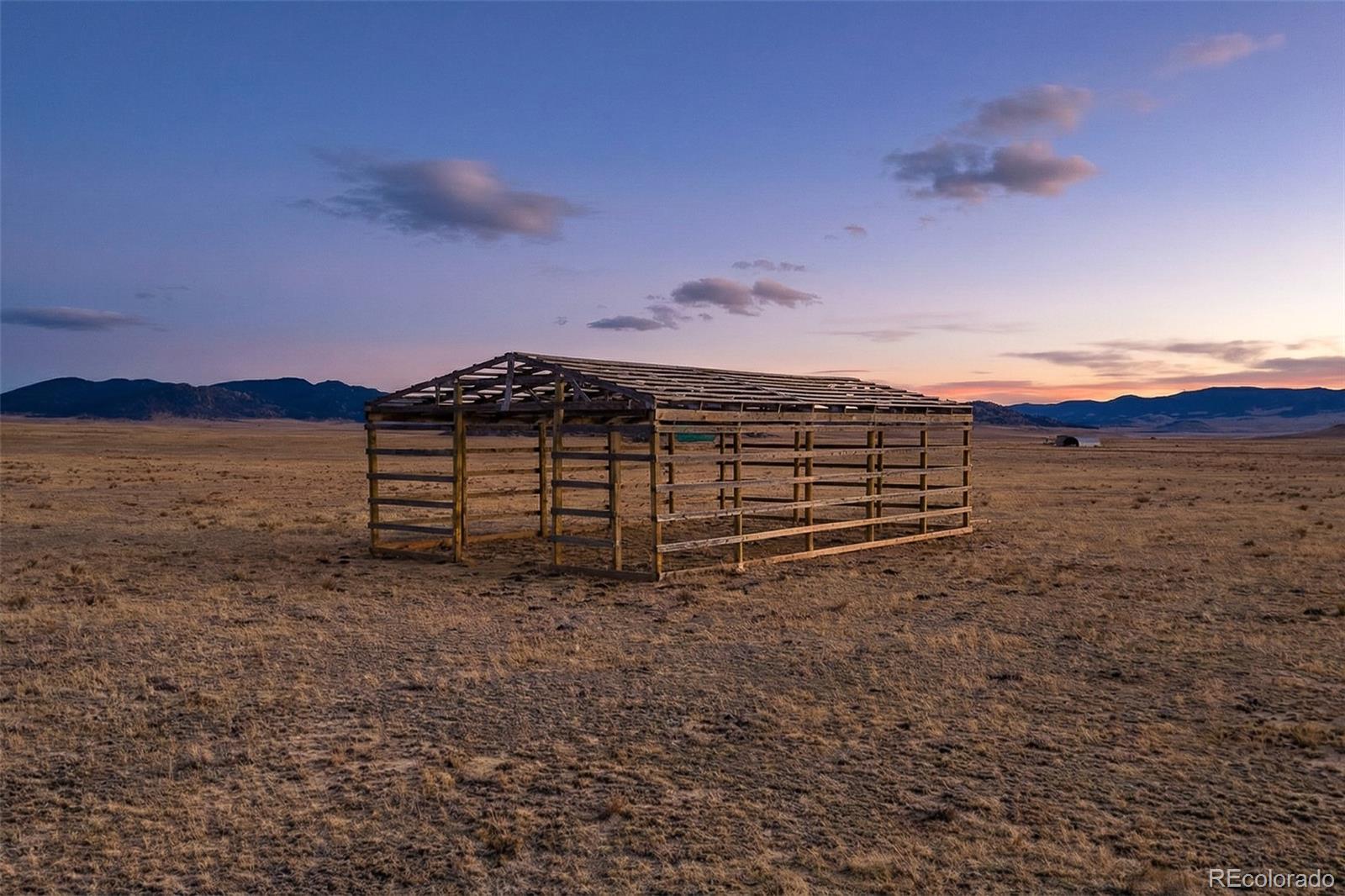 5372 Routt Road Hartsel, CO 80449 - Photo 3 of 10 a view of a dry yard with wooden fence