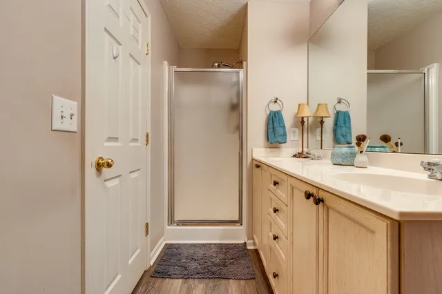 a bathroom with a double vanity sink and a mirror