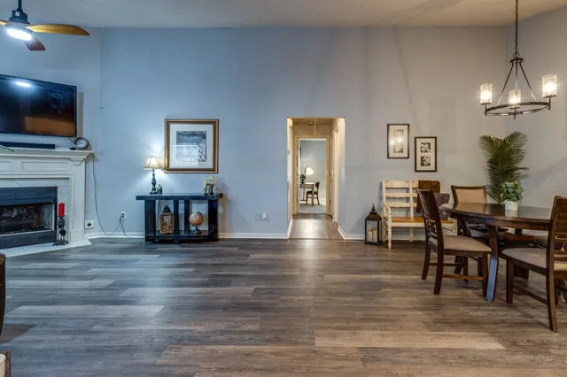 a view of a livingroom with furniture and a flat screen tv